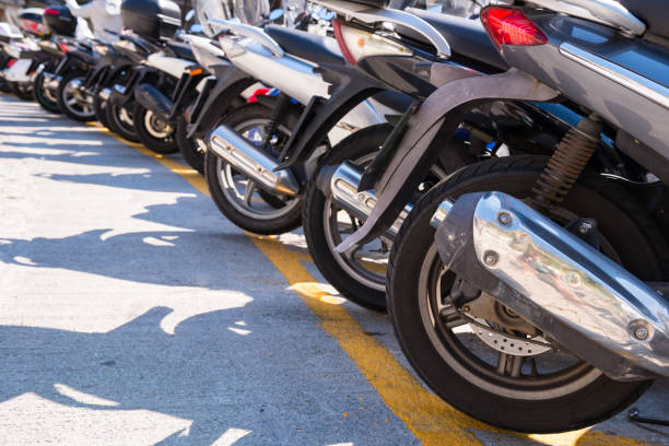 Row of scooters Row of scooters on the street on sunny day rent a bike stock pictures, royalty-free photos & images