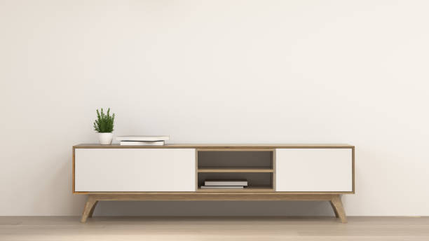 istock clean modern Tv wood cabinet in empty room interior background  3d rendering home designs,background shelves and books on the desk in front of  wall empty wall 1148624991