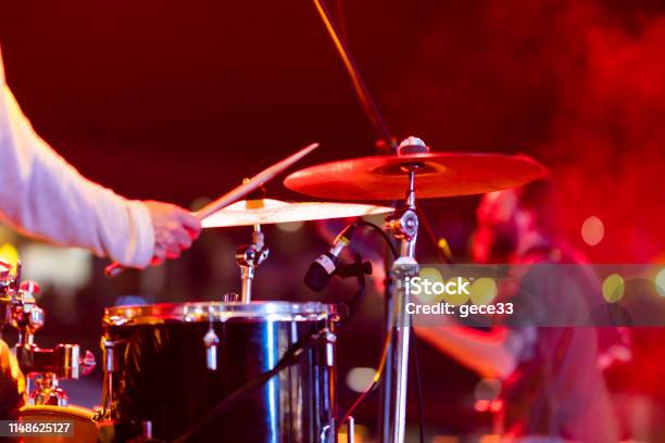 Drummer Playing Drums On Stage Stock Photo - Download Image Now - Performance Group, Drummer, Playing