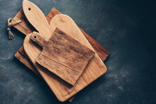 istock Vintage wooden cutting boards on a gray background, flat lay. Overhead view, copy space. 1148626494