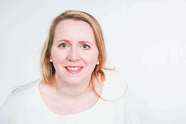 istock Studio portrait of smiling middle aged woman. 1148626995