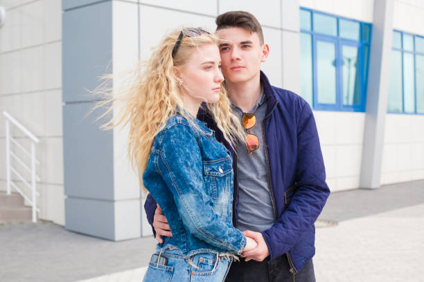 istock Girl and boy, jeans jacket, fun, close up 1148629300