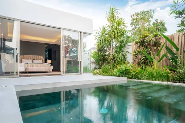 Photo of home or house building Exterior and interior design showing tropical pool villa with green garden and bedroom