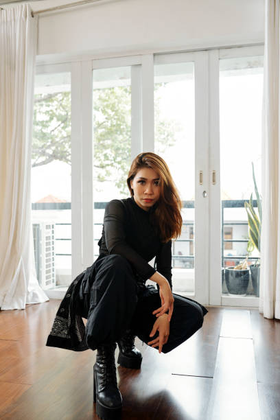 istock Stylish woman in black clothes 1148631566