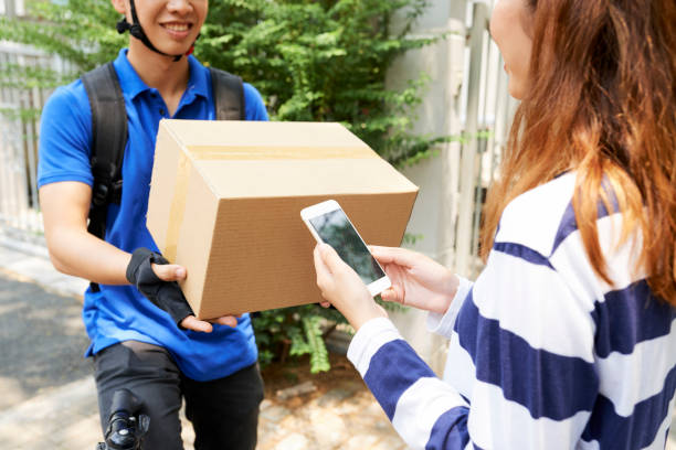 istock Woman tracking courier via mobile app 1148632495
