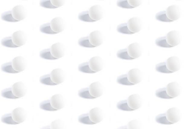 istock Pattern of a white ping-pong ball on a uniform background 1148634161