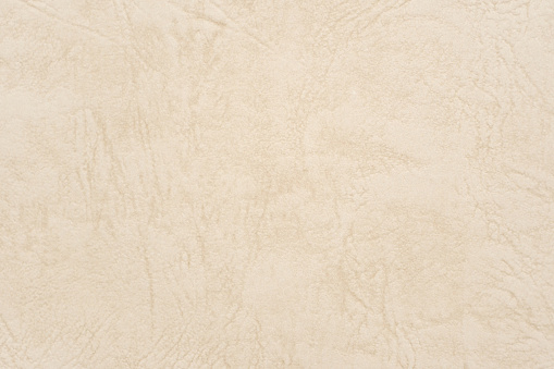 Fondo de papel de textura de cuero beige abstracto o telón de fondo. Hoja de pergamino de crema vieja vacía para elemento de diseño decorativo. Superficie arrugada de color marrón claro para presentación de plantilla de diario. photo
