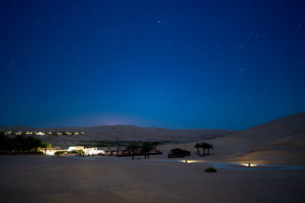 istock Starry night sky over dune dessert 1148636522
