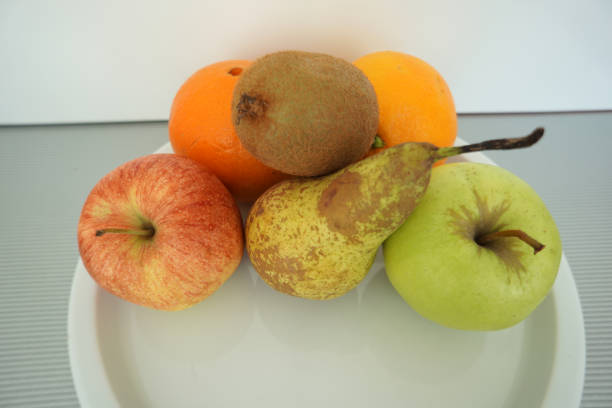This is fruit served on the tray and photographed on white plate