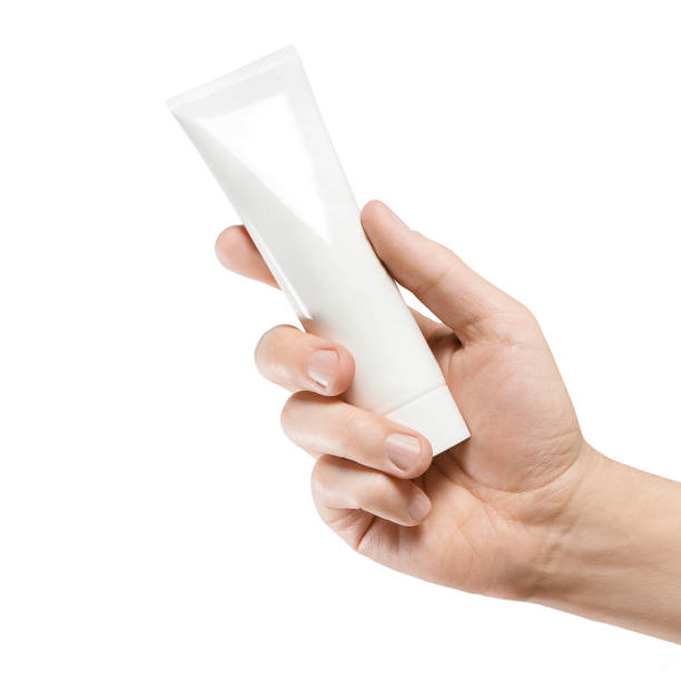 istock Hand holding a white tube 1148643859