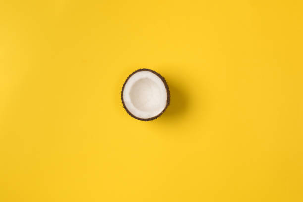 istock Summer composition. Coconut on yellow background. Summer concept. Flat lay, top view, copy space 1148644096