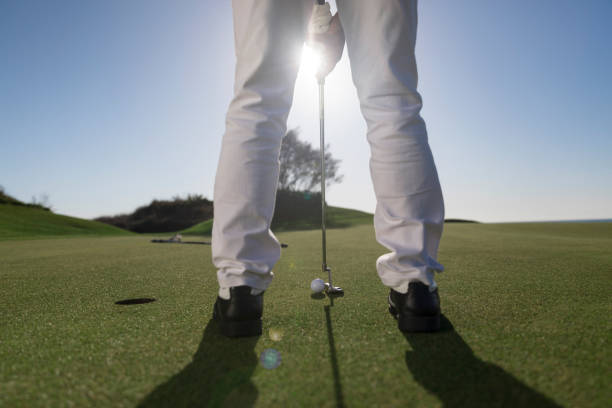 istock Golfer teeing off the ball - ready for putt - links golf - backlit 1148645643