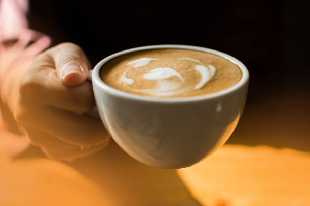 istock A woman is holding coffee by one hand 1148646945