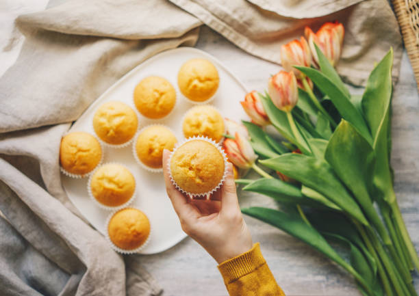 Unfrosted cupcakes on a white plate from above