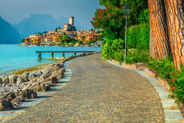 Photo of Malcesine cityscape with promeande and lake Garda, Veneto region, Italy