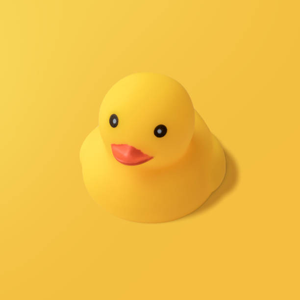 istock Yellow rubber duck on yellow background Modern style. creative photography. 1148650052