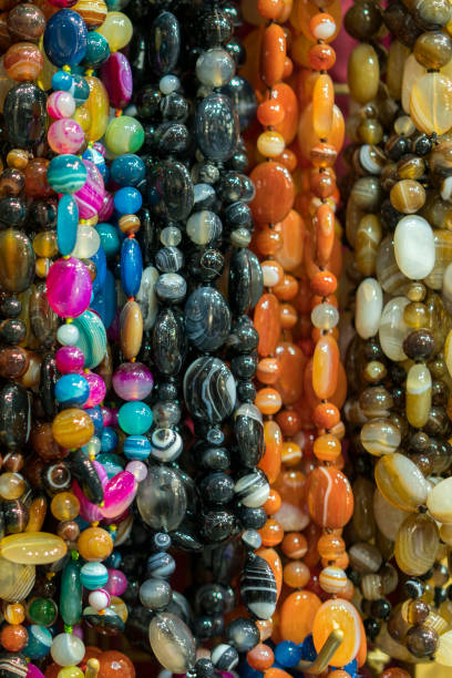 istock Background from beads. beads market necklaces. vertical photo 1148655410