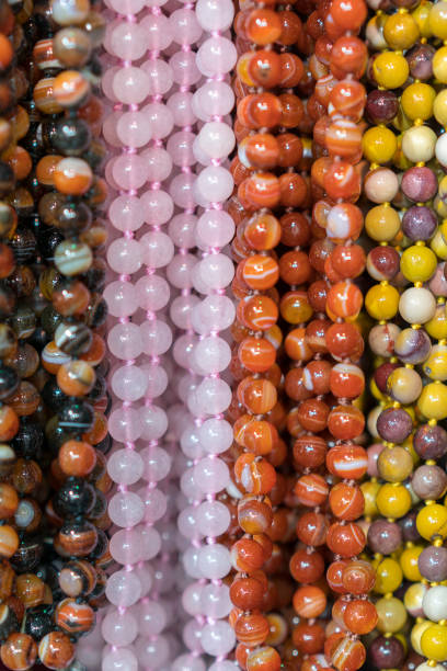 istock Background from beads. beads market necklaces. vertical photo 1148655523