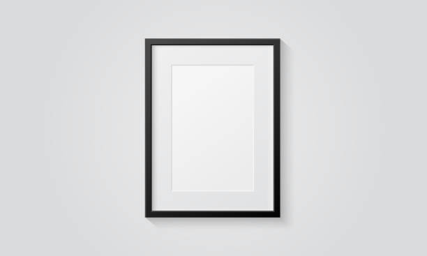 istock Picture frame isolated on a wall. Black and white color. Realistic modern template. A4 vertical format. Mock up for pictures or photo. Beautiful minimal clean design. Eps 10 vector illustration. 1148661238