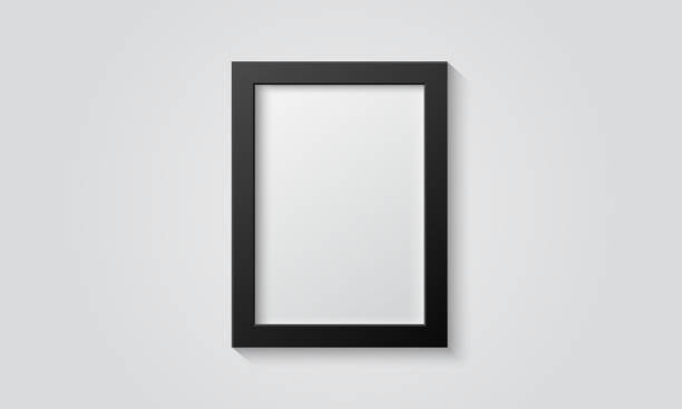 istock Picture frame isolated on a wall. Black and white color. Realistic modern template. A4 vertical format. Mock up for pictures or photo. Beautiful minimal clean design. Eps 10 vector illustration. 1148661254