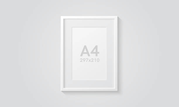 Picture frame isolated on a wall. White color. Realistic modern template. A4 vertical format. Mock up for pictures or photo. Beautiful minimal clean design. Eps 10 vector illustration. Picture frame isolated on a wall. White color. Realistic modern template. A4 vertical format. Mock up for pictures or photo. Beautiful minimal clean design. Eps 10 vector illustration. a4 paper stock illustrations