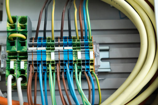 istock many colorful electrical wires lead into a relay and transformer panel on a wall 1148661694