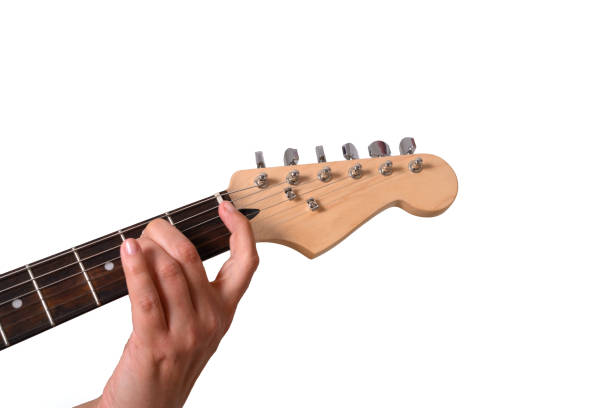istock A woman is playing an electric guitar 1148664236