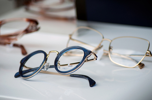 closeup of eyeglasses collection in store showroom