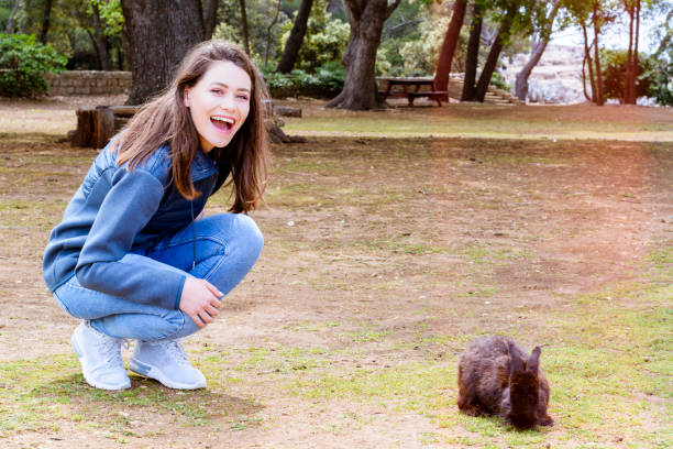 istock Beautiful girl with rabbit 1148666478