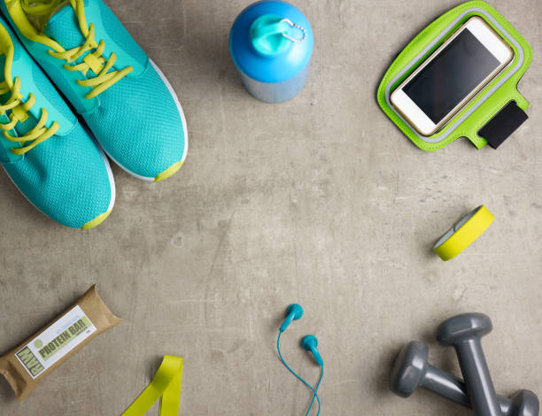 istock Closeup on dumbbells, raw protein bar, fit tracker, smartphone 1148668146