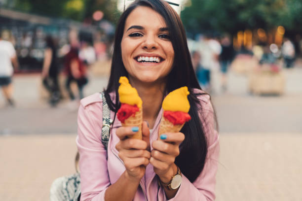 istock Girl eating an ice-cream 1148668232