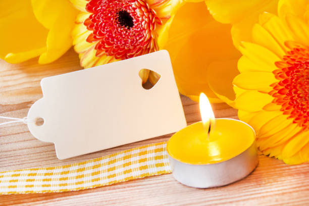 istock Decoration with Gerbera flowers and candle with label 1148670359