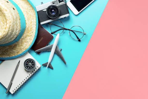 istock Travel accessories objects and gadgets top view flatlay on blue yellow pink 1148670638