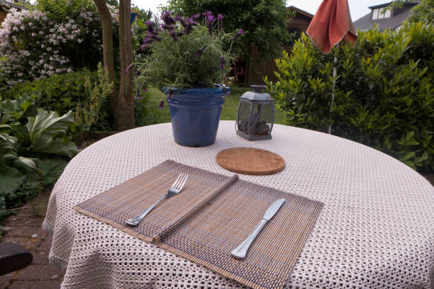 istock Round table on the terrace covered with knife and fork 1148675545