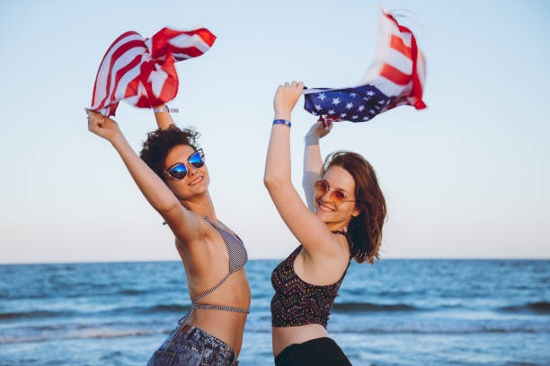 istock Waving USA flag at the beach 1148675690