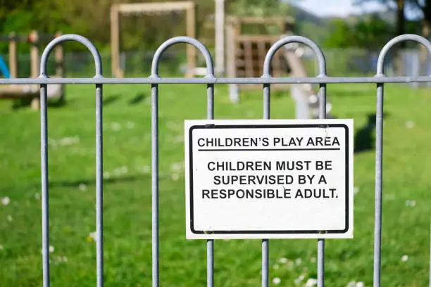 Children must be supervised by responsible adult sign at children's play area park uk