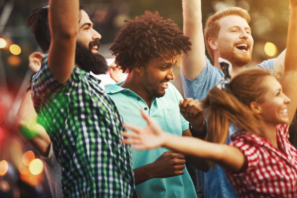 istock Friends dancing at a concert. 1148678380
