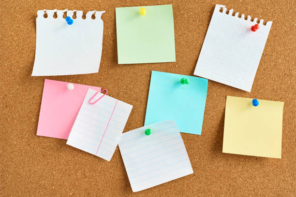 istock colored paper stickers on a cork board background 1148678613