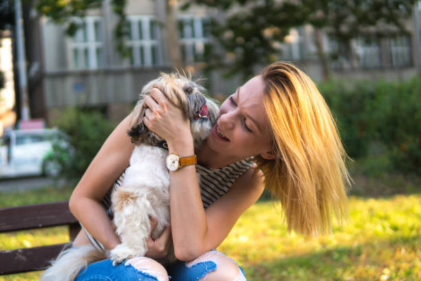 istock Woman with dog in a park 1148680248