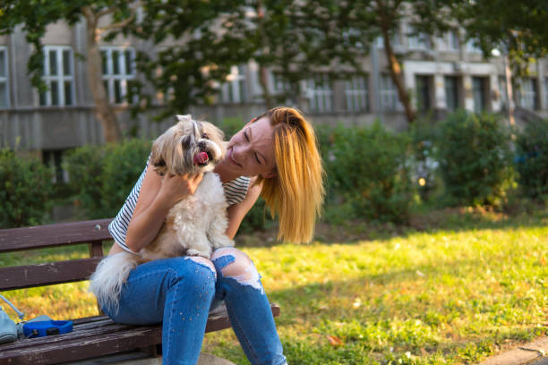 istock Woman with dog in a park 1148680289