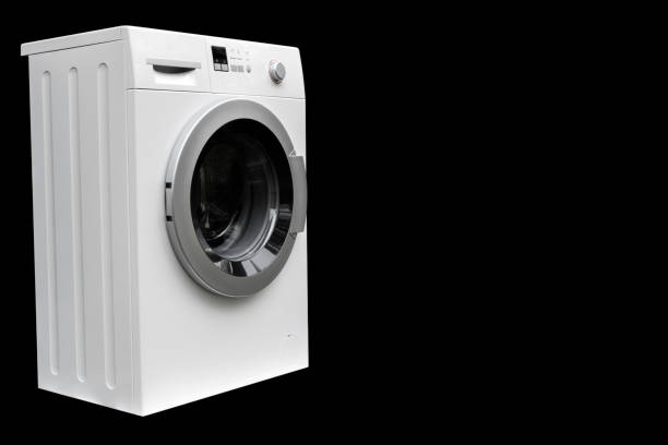 Washing machine isolated on black background. Washing machine isolated over black.