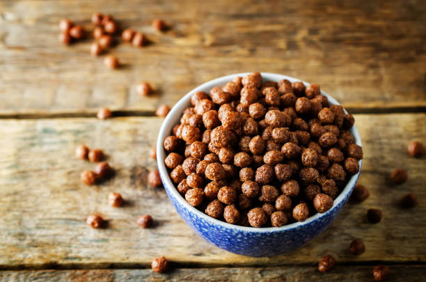 istock Breakfast crunchy chocolate balls on a dark wood background 1148683939