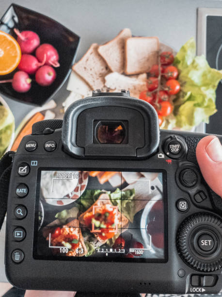 istock Photographing bruschetta with cherry and mozzarella in the kitchen 1148685404