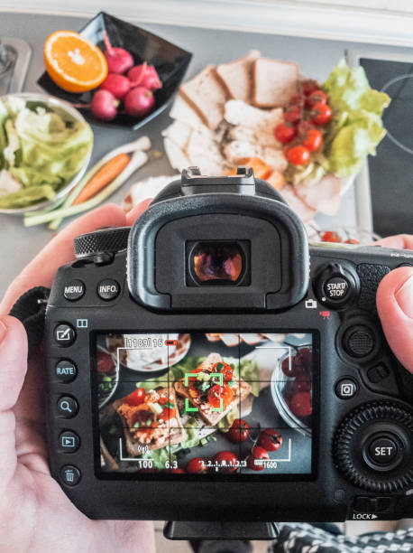 istock Photographing bruschetta with cherry and mozzarella in the kitchen 1148685435