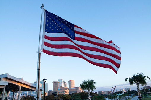 U. S. Flag flying over Tampa skyline