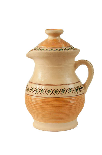 Ceramic crockery. Traditional Ukrainian brown jar with one handle and geometric pattern.