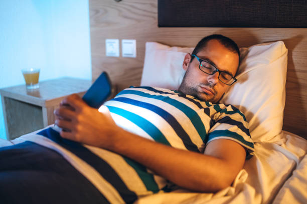 istock Man asleep with phone in hand 1148690342
