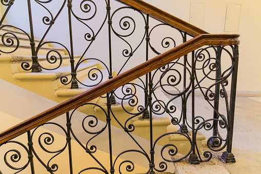 steps with handrails, forged staircase indoors