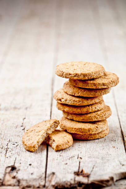 istock Fresh oat cookies on rustic wooden table background. 1148692662
