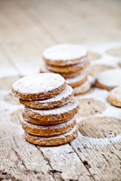 istock Fresh oat cookies with sugar powder on rustic wooden table. 1148694197